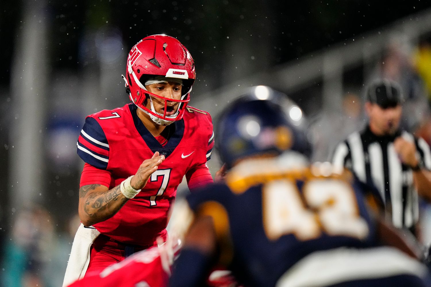 Dec 20, 2022; Boca Raton, Florida, USA; Liberty Flames quarterback Kaidon Salter (7) calls the snap against the Toledo Rockets during the second half in the 2022 Boca Raton Bowl at FAU Stadium. Mandatory Credit: Rich Storry-USA TODAY Sports